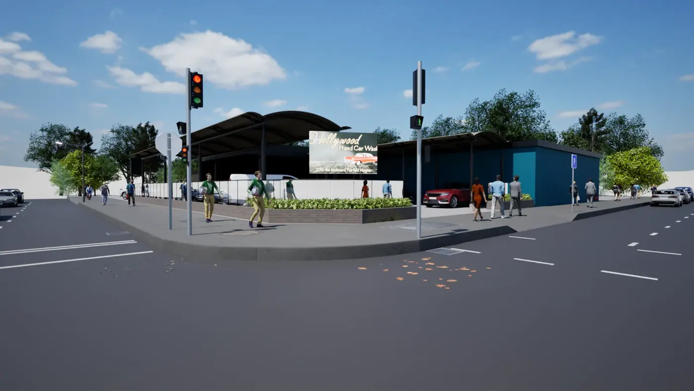 Render 2 of 5: corner hand car wash with curved canopy and landscaped planter, Fairfield Heights